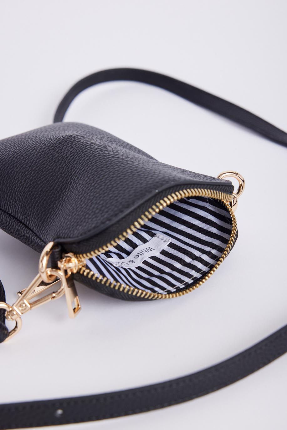 white-co-on-the-go-pouch-black-black-lurex-stripe